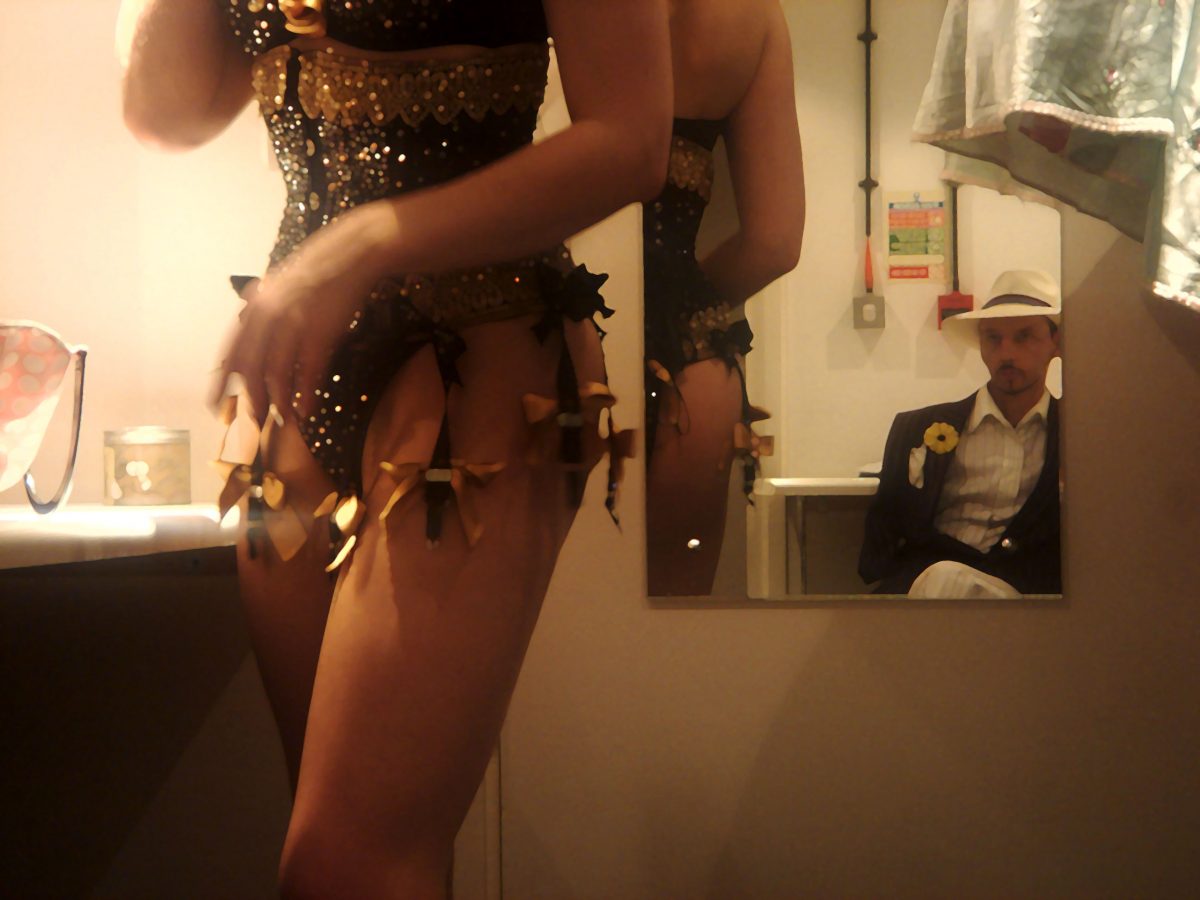 Working late in the office. Backstage at the Pigalle supper club (at Piccadilly Circus) as a floor-warmer and taxi dancer and sharing a changing room with the burlesque performer; Gwendoline Lamour, 2006